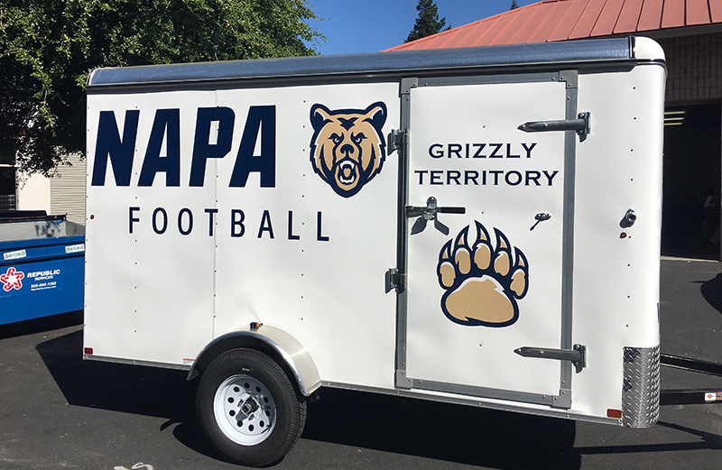 white cargo trailer with Napa football logo on the side.