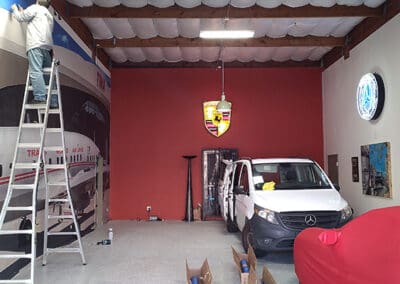 Man on ladder in workspace